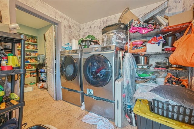 laundry room with light tile patterned floors and separate washer and dryer