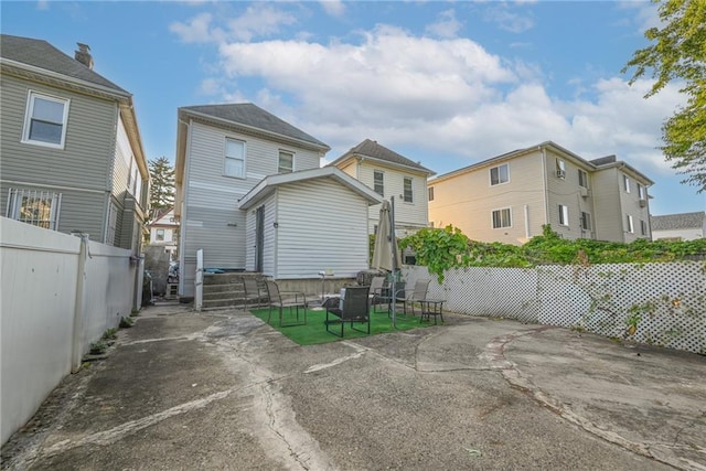 rear view of house with a patio