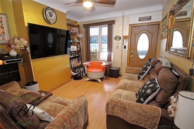 living room with ceiling fan and hardwood / wood-style floors