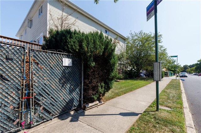 view of side of property with a lawn