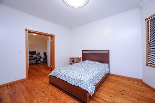 bedroom featuring wood-type flooring and crown molding