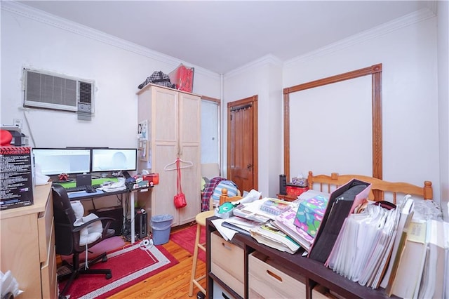 office space featuring light hardwood / wood-style floors, a wall mounted air conditioner, and ornamental molding