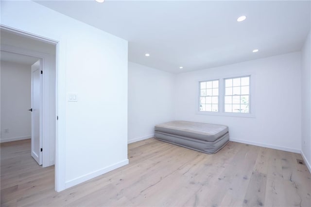 unfurnished bedroom featuring light wood-type flooring