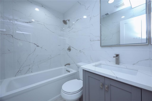 full bathroom with tiled shower / bath, decorative backsplash, tile walls, toilet, and vanity