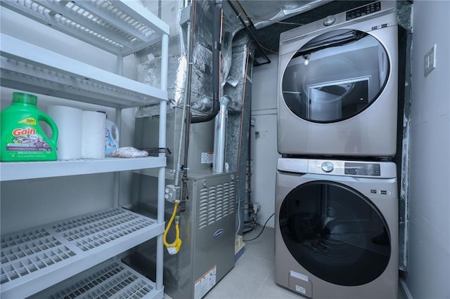 laundry area with stacked washer / dryer