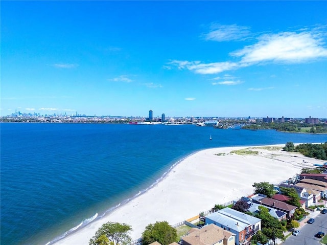 aerial view featuring a water view and a beach view