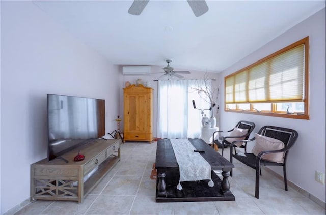 exercise area with a wall unit AC, ceiling fan, baseboards, and light tile patterned floors