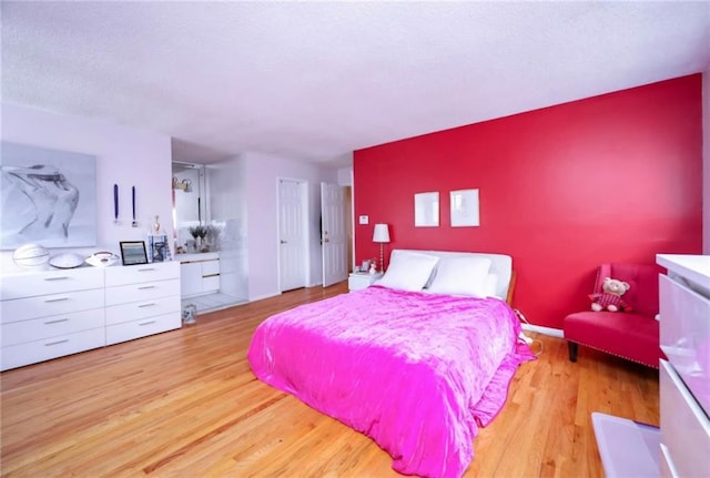 bedroom featuring wood finished floors