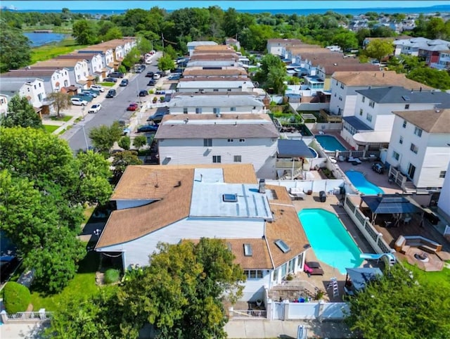 birds eye view of property with a residential view