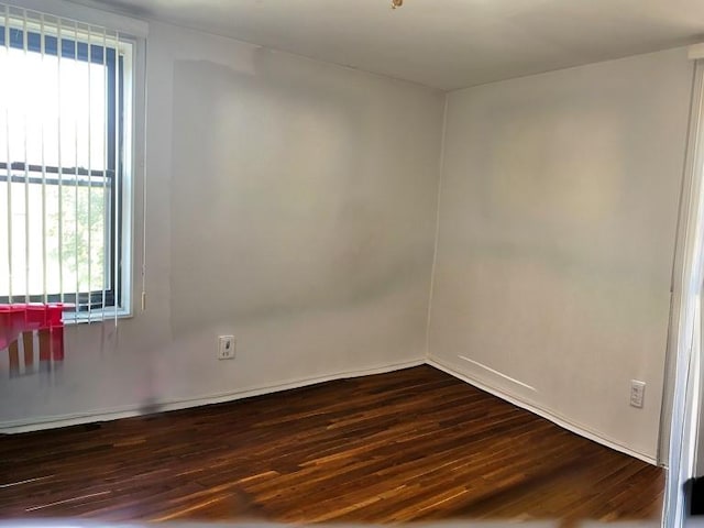 spare room featuring hardwood / wood-style flooring