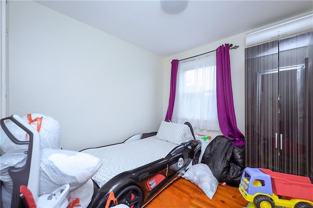 bedroom with wood finished floors