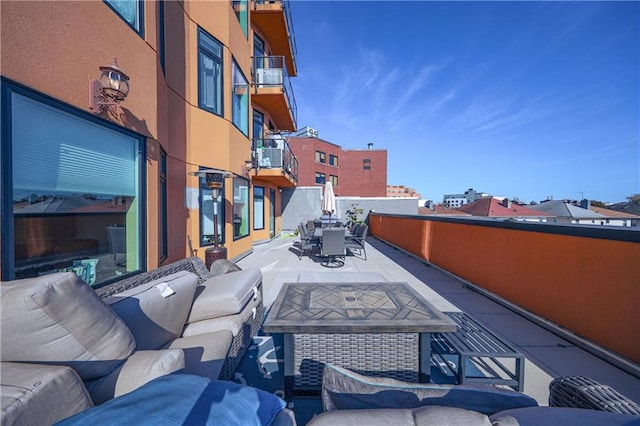 view of patio / terrace featuring a balcony and an outdoor living space