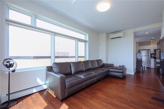 living room with a wall mounted air conditioner, a healthy amount of sunlight, and dark wood-type flooring