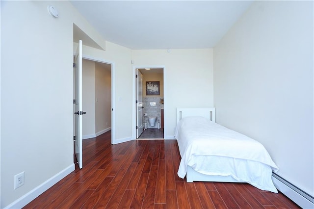 unfurnished bedroom with dark hardwood / wood-style floors, ensuite bath, and baseboard heating