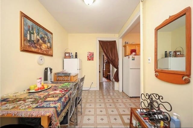 dining area featuring light floors