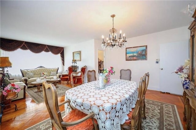 dining space with a chandelier and wood-type flooring