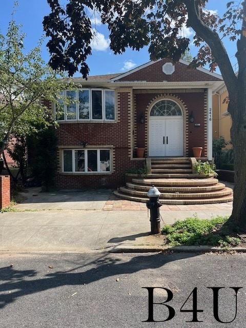 view of front of property with brick siding and entry steps