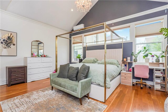 bedroom featuring an inviting chandelier, light hardwood / wood-style flooring, multiple windows, and ornamental molding