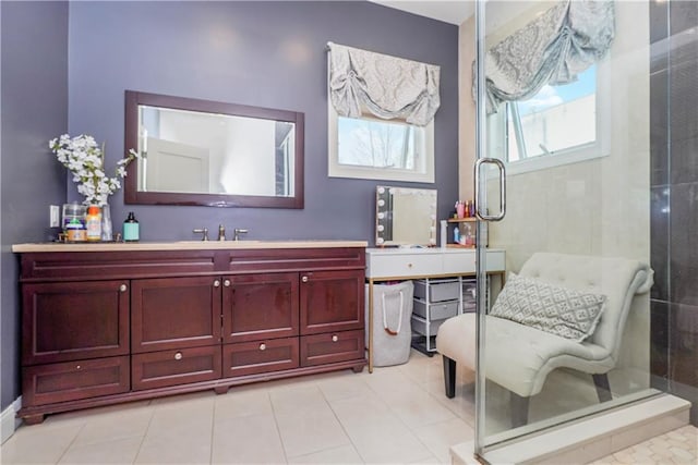 bathroom with vanity, tile patterned floors, and a shower with shower door