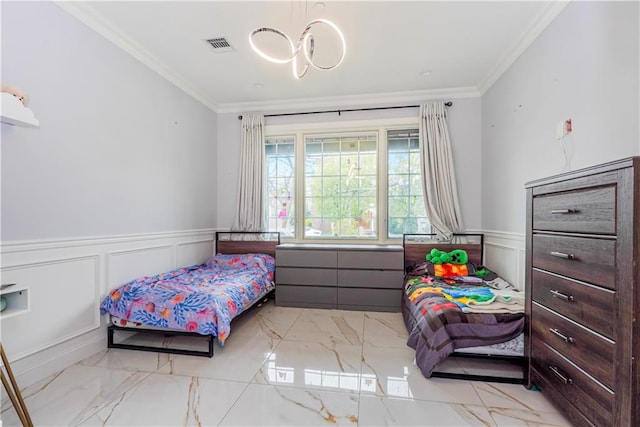 bedroom featuring visible vents, wainscoting, marble finish floor, and ornamental molding