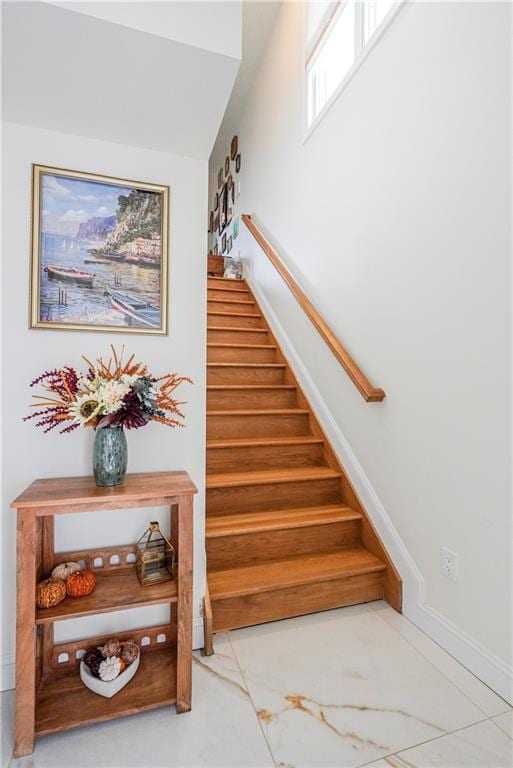 stairs with baseboards