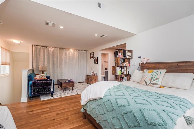 bedroom with recessed lighting, visible vents, and light wood finished floors