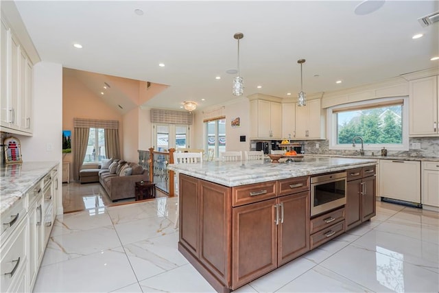 kitchen featuring built in microwave, marble finish floor, dishwasher, and tasteful backsplash