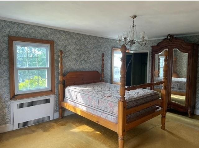 carpeted bedroom featuring a chandelier, multiple windows, and radiator