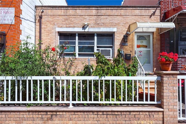 exterior space featuring brick siding