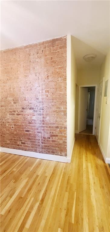 unfurnished room with light hardwood / wood-style flooring