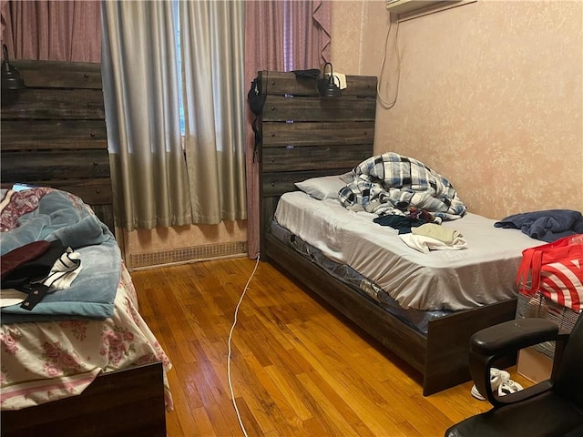 bedroom featuring hardwood / wood-style floors