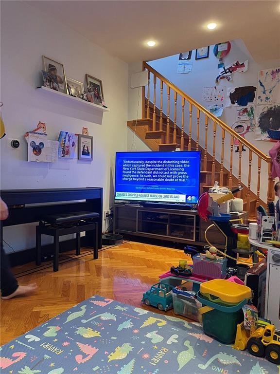 game room featuring parquet flooring