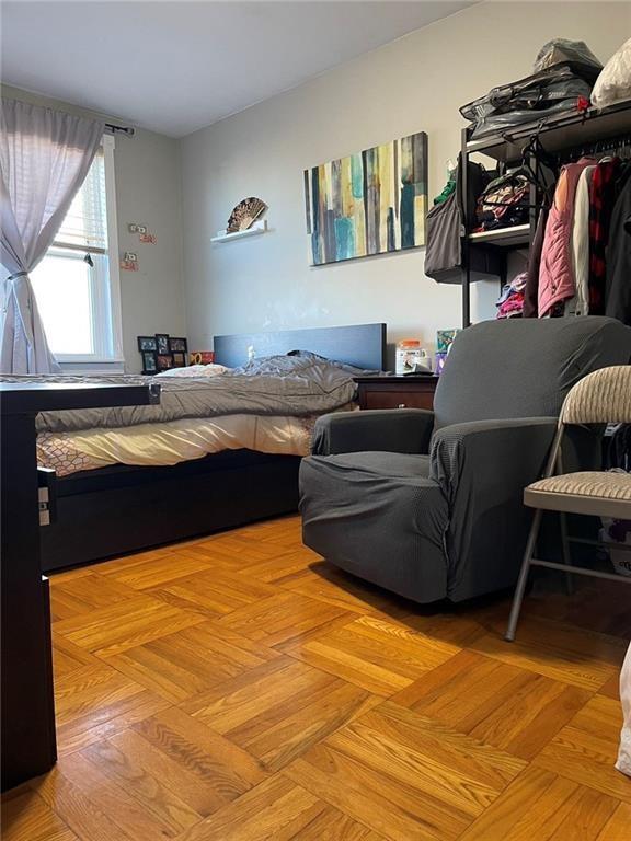 bedroom featuring light parquet flooring