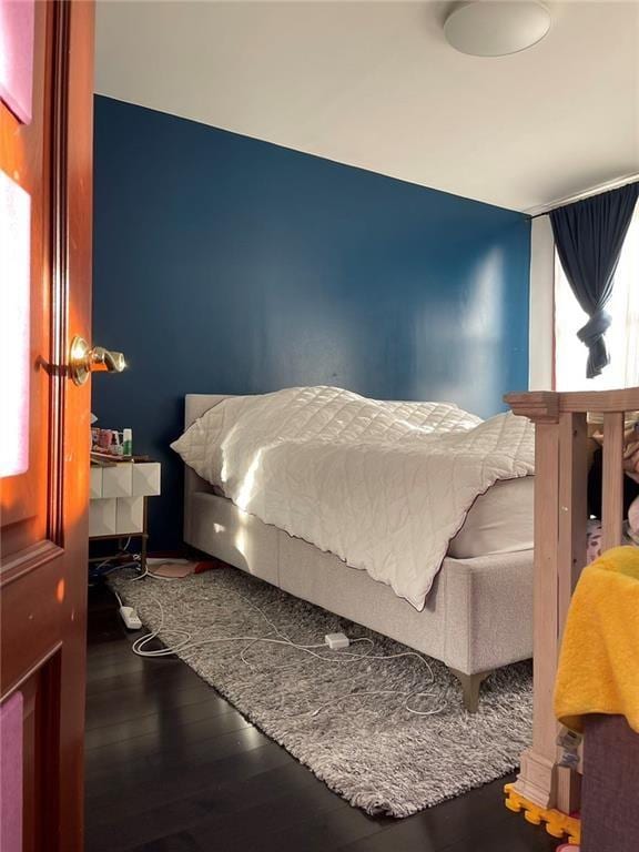 bedroom featuring hardwood / wood-style flooring