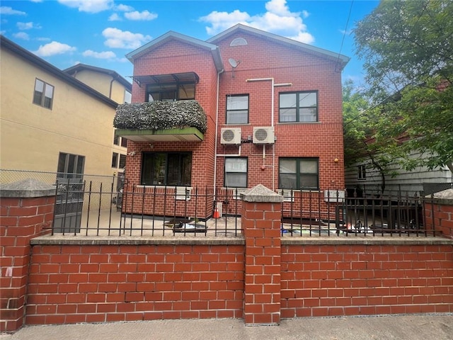 view of front of property featuring ac unit