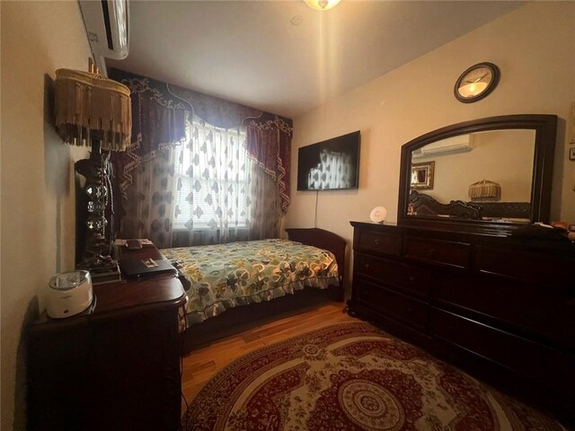 bedroom featuring wood-type flooring