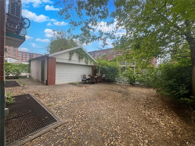 view of home's exterior with an outdoor structure and a garage