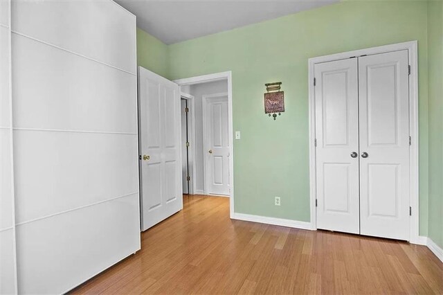 unfurnished bedroom featuring light hardwood / wood-style flooring