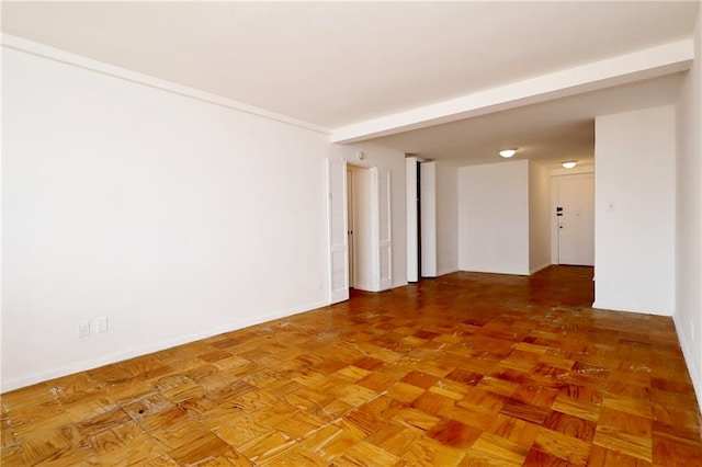 empty room featuring baseboards