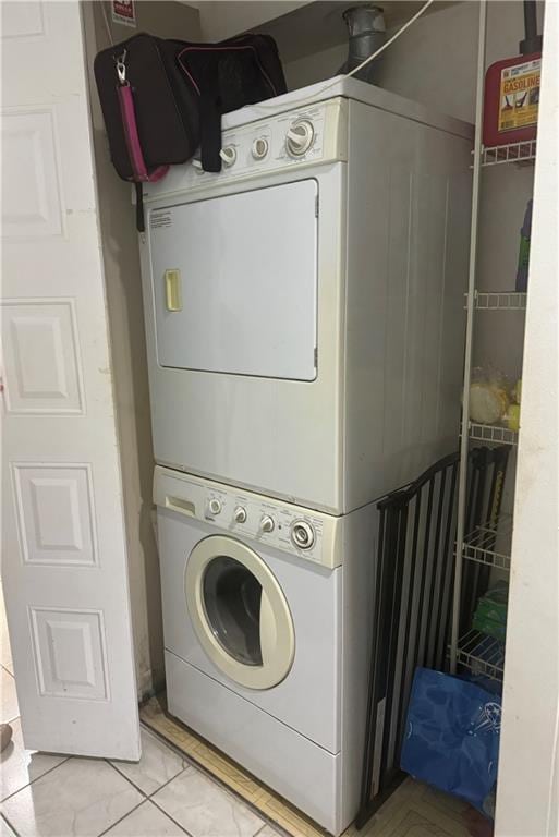 washroom with stacked washer / dryer