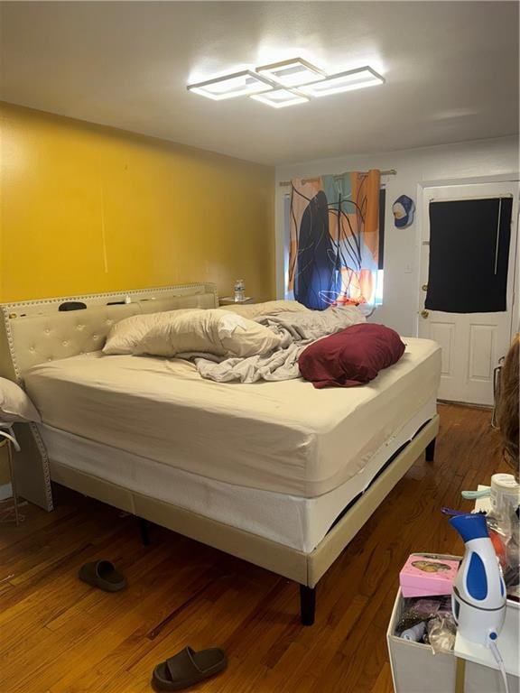 bedroom featuring dark wood-type flooring