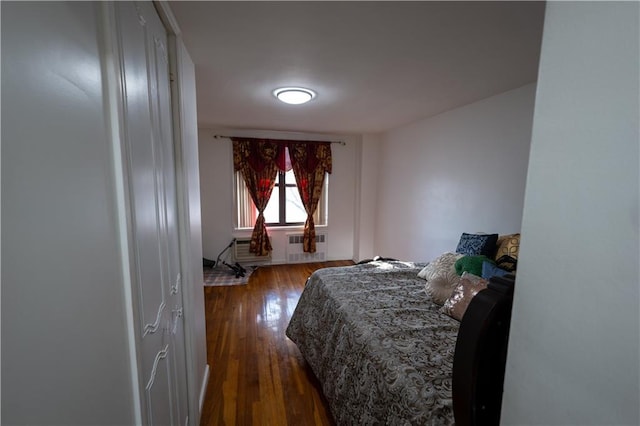 bedroom featuring dark wood-style floors