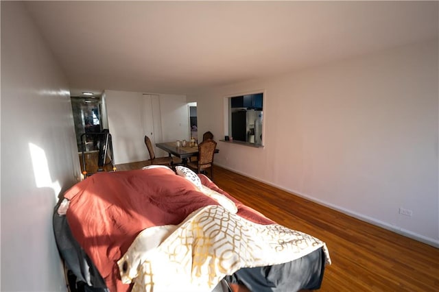 interior space featuring baseboards and wood finished floors