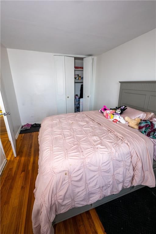 bedroom featuring a closet and wood finished floors