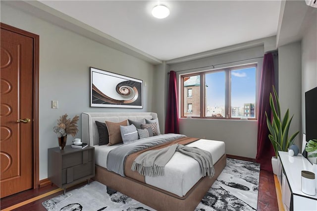 bedroom featuring dark hardwood / wood-style flooring