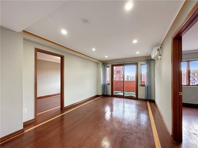 empty room with crown molding, a healthy amount of sunlight, and dark hardwood / wood-style flooring