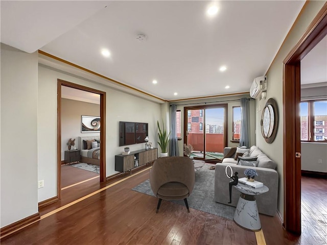 living room with ornamental molding, dark hardwood / wood-style floors, and an AC wall unit