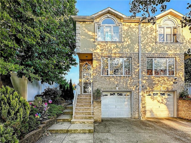 townhome / multi-family property featuring a garage