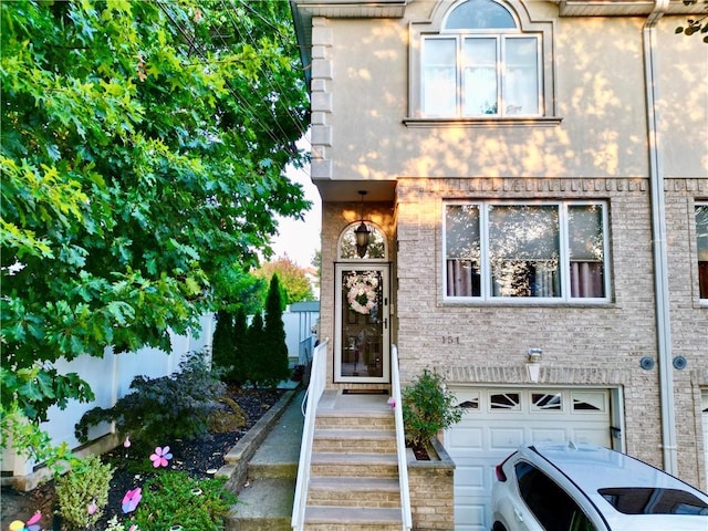 view of exterior entry featuring a garage