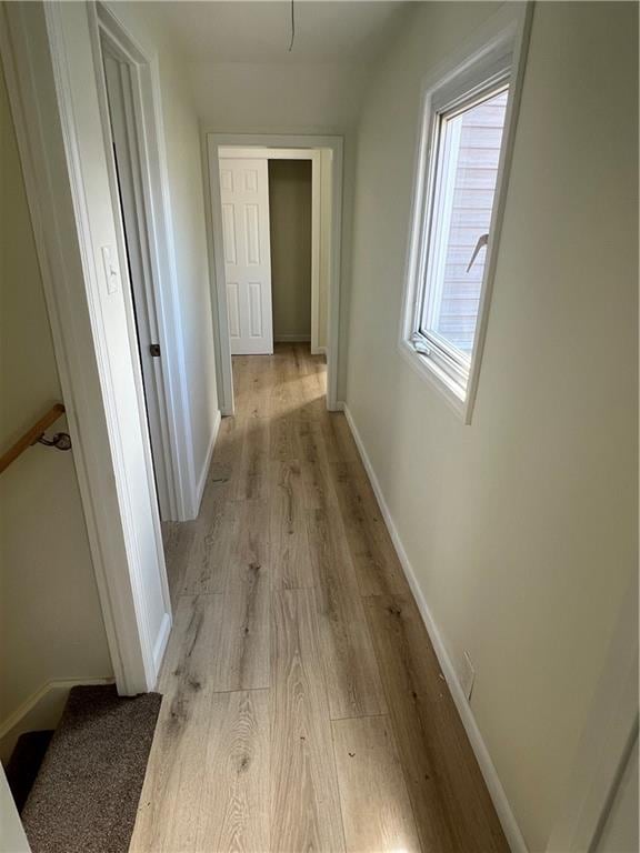 corridor featuring light hardwood / wood-style flooring